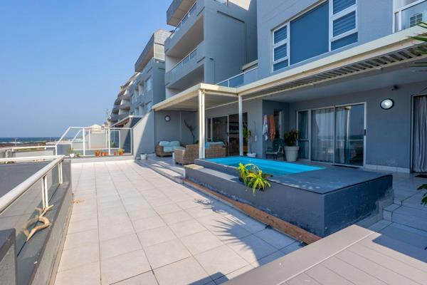 Welcome to a truly unique property that redefines coastal living! This exquisite three-bedroom apartment is not just a place to live ...