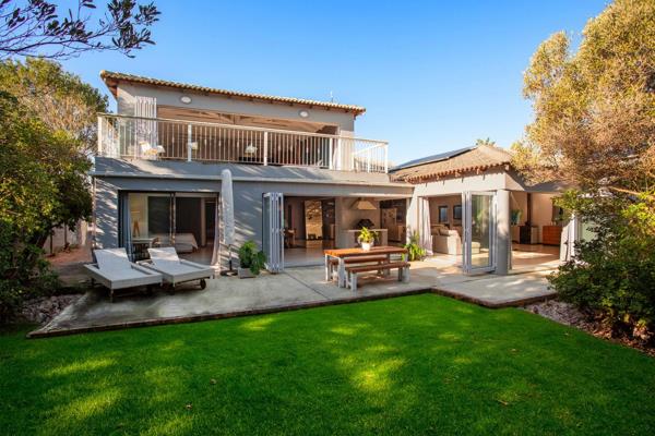 Experience modern sophistication and coastal elegance in this stunning Sunset Beach home, where modern sophistication meets beach house ...