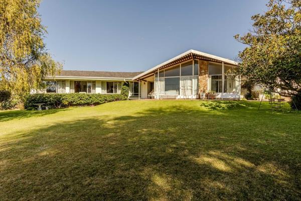 Presenting a very unique property with a vintage feel and modern overtones. This expansive property boasts with a sprawling parklike ...