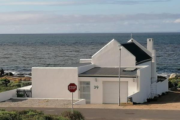 This beautiful three-bedroom, three-bathroom beachfront home offers family living with ...