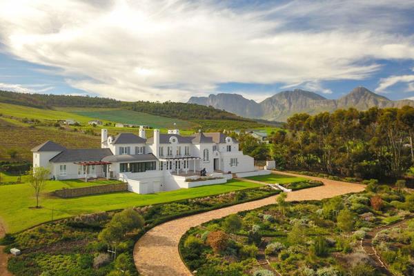 This distinguished 5-bedroom home, inspired by French chateau architecture, seamlessly blends modern elegance with clean architectural ...