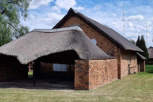 Experience the allure of year-round holiday living in this magnificent 3-bedroom thatched roof cluster home that promises relaxation ...