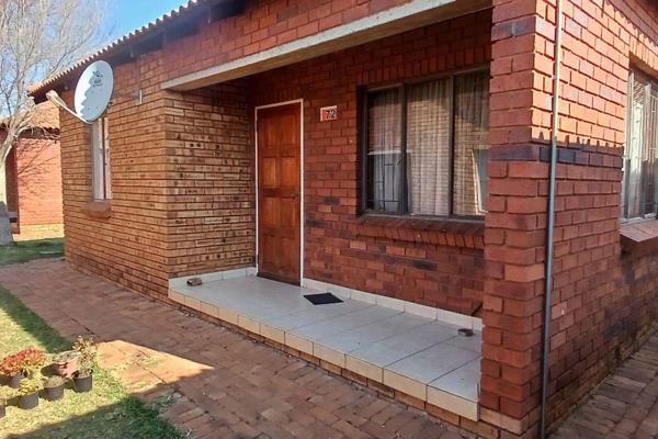 This neat free standing, face brick Home is a must see!

The kitchen and spacious lounge ...