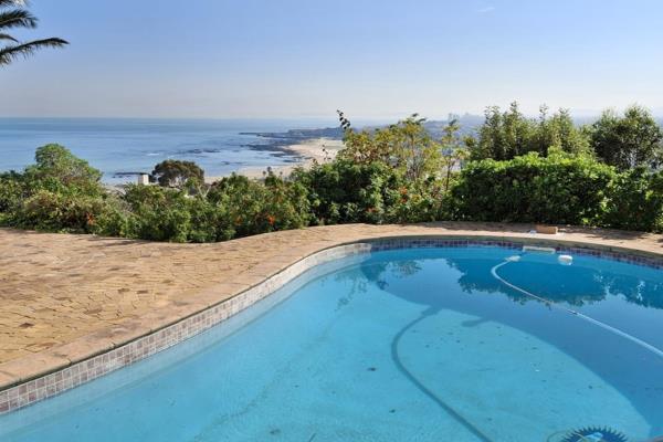 Discover this very modern, elegant, and stylish 2-story home in Mountainside, Gordons Bay offering spectacular views of the entire ...