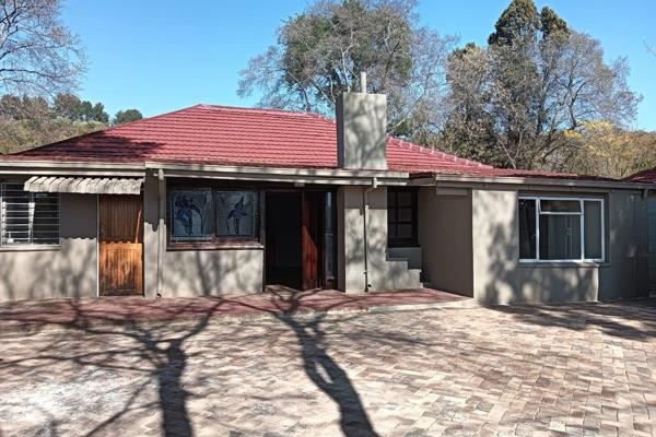 This spacious property features a main house with four ensuite bedrooms and a separate flatlet, offering a total of four bathrooms. The ...