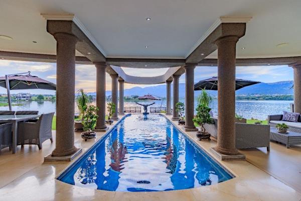 Positioned on the banks of Hartbeespoort Dam, this entertainer&#39;s paradise offers a 270-degree water frontage with uninterrupted ...