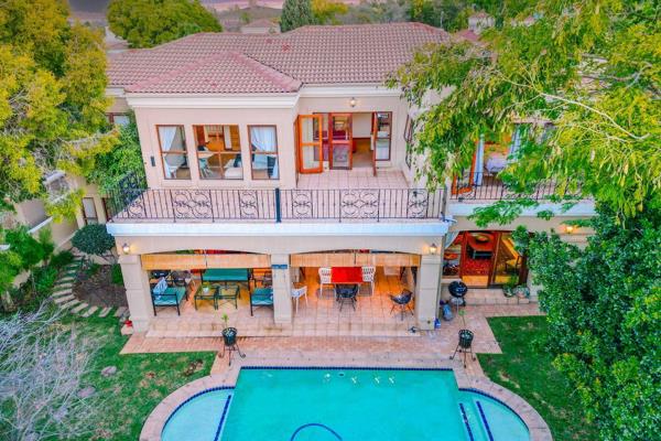 This home has it all !
Starting with a gorgeous courtyard garden leading to the double front doors. These open to the double volume ...