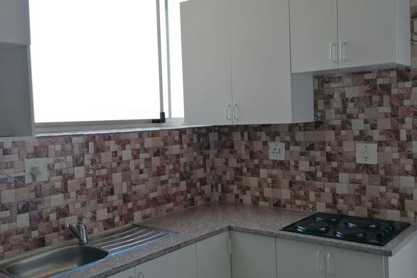 Neat and secure apartment available immediately close to all amenities . Fully tiled floors. The kitchen is fully fitted with a four ...