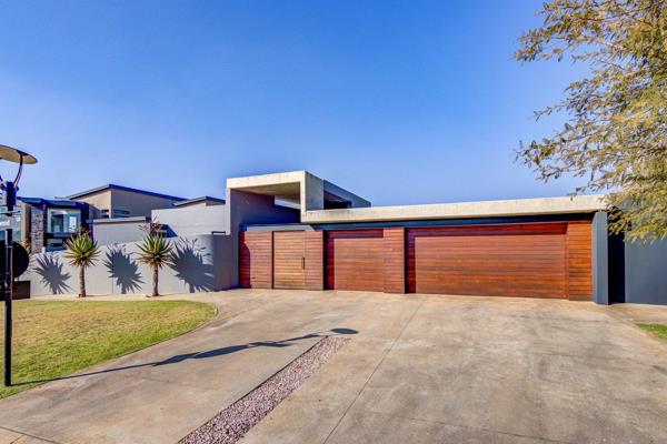 This exquisite family home is an architectural masterpiece featuring solar panels, an ...