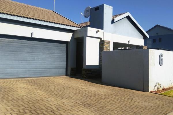 Beautiful Open-planned Kitchen, fitted with Granite Tops and ample cupboard space that reaches up to the ceiling. 

The Kitchen leads ...