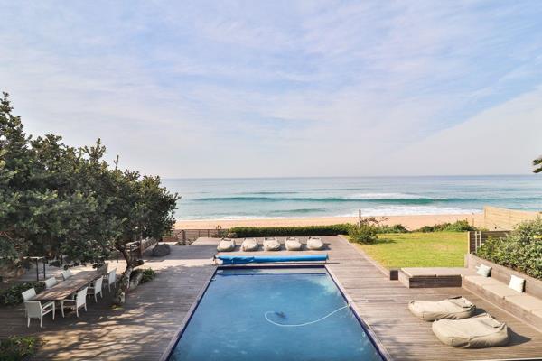 Discover beachfront opulence in this stunning home nestled along Clansthal Green Point Drive. With direct beach access that extends to ...