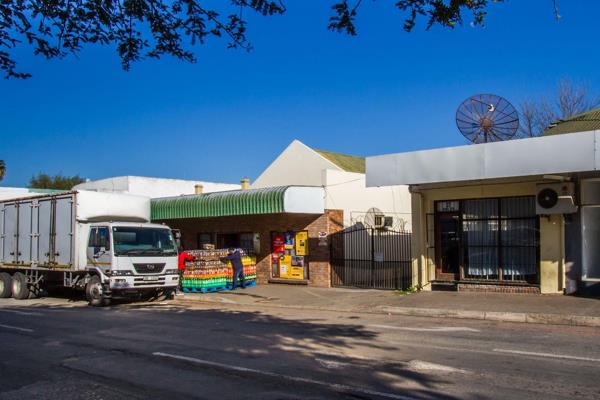 This mixed-use property features both commercial and residential spaces, making it a great investment. 

At the front, a supermarket ...