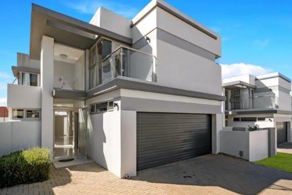 This immaculate and modern home nestled in the heart of Bryanston, a prime and sought ...