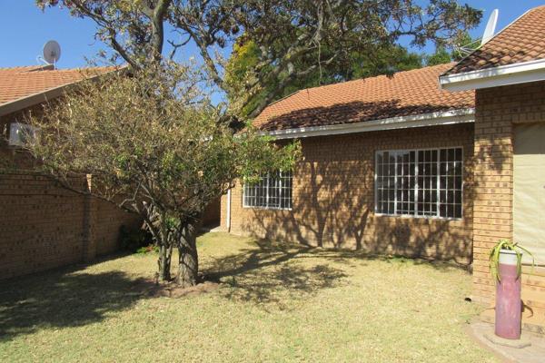 Bosveldsig Security Complex: Full-title 3-bedroom house with a tile roof and face brick walls. The complex features a central remote ...