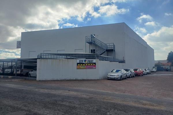 This expansive property, formerly a car dealership, offers endless possibilities for developers and investors.  Featuring both ground ...