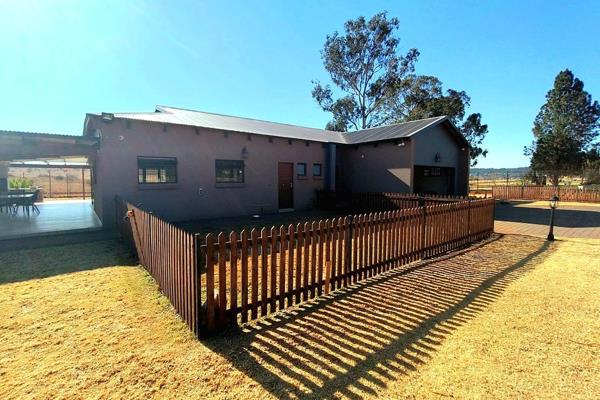 Nestled amidst rolling countryside of Kloofsig, this enchanting farmhouse exudes classic equestrian elegance. Its imposing presence is ...