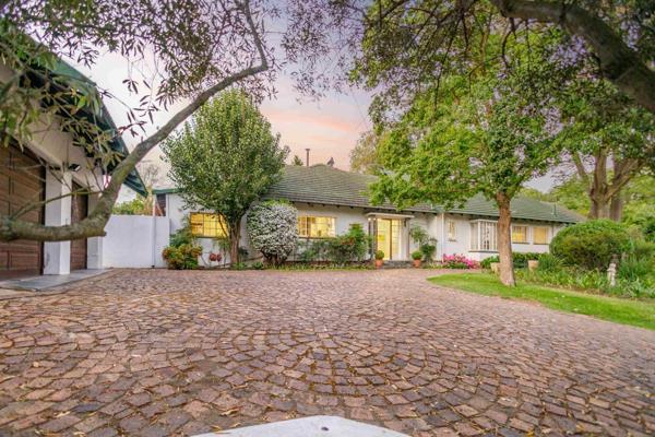 Nestled in a lush, established garden, this exquisite single-story home offers a rare blend of English country charm and modern ...