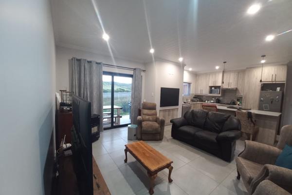 Lovely townhouse for sale in secure estate with mountain views. Only 11 km from Hartenbos CBD and about 32km from George Airport. ...