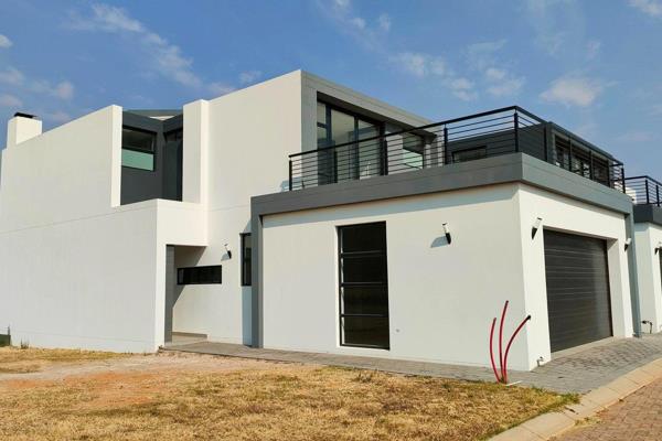 Experience luxury living in this newly built 3-bedroom house located in the secure and ...