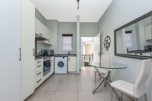 This top-floor apartment offers stunning views and is ideal for both living and investment. The modern open-plan kitchen features sleek ...