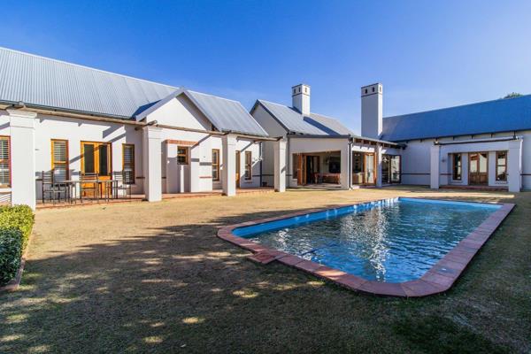 Nestled in the prestigious Eco Estate Meyersdal, this Cape-style family farmhouse is a stunning creation by the renowned designer ...