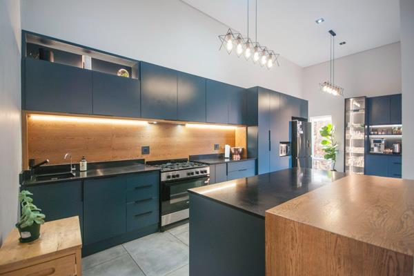 This beautiful home has a modern yet farm style feel to it. The kitchen is sleek and modern with aa scullery area and coffee station. ...