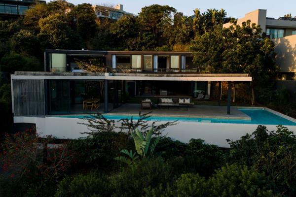 This beautiful modern home with an eye for architectural design, is perched on the hill ...