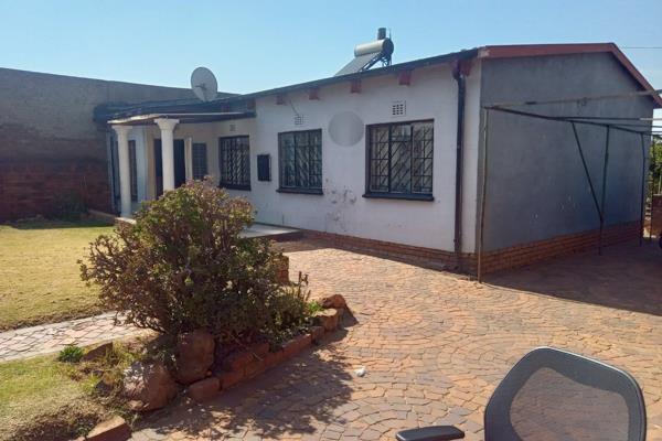 This four-bedroom house features a separate kitchen, lounge, toilet, and bathroom. It boasts a spacious yard, perfect for family ...