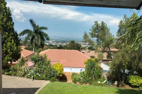 Property for sale in an estate in Safari Gardens, Rustenburg, with a stunning view. This property features an open-plan living room ...