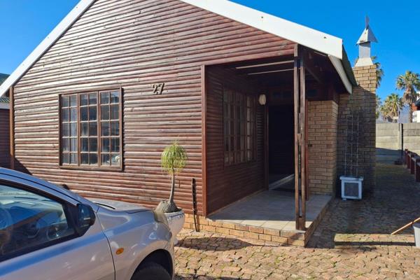 Charming log cabin set in well-established holiday resort one street block away from the beach in Strand South.  Neighbouring the ...