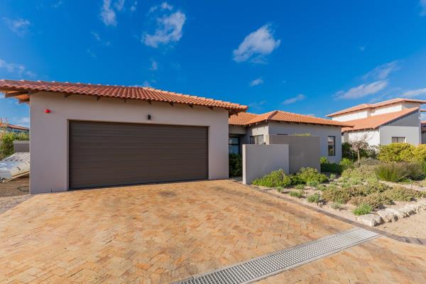 Exclusive Sole Mandate

Welcome to this modern three-bedroom, two-bathroom residence in the coveted Langebaan Country Estate, a ...