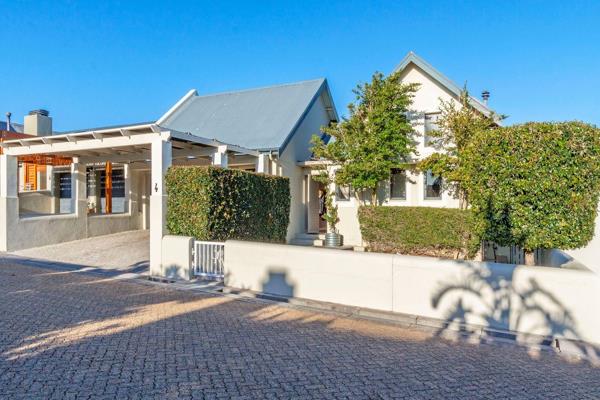 Discover the perfect blend of comfort and classic elegance in this delightful single-level home, located in the esteemed Schonenberg ...