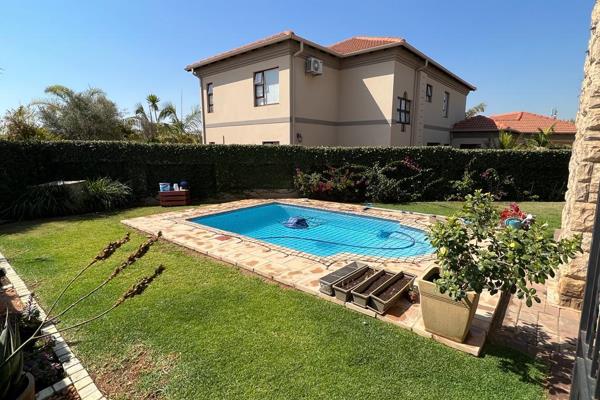 4 Separate living areas, includes closed up patio with stack doors that open up to pool.

Build-in braai with large boma

Kitchen with ...