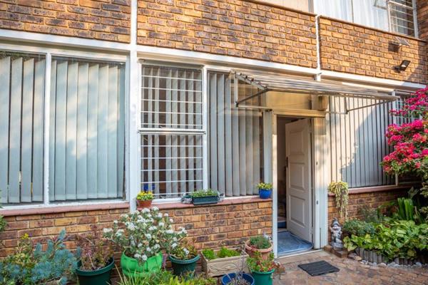 Step into a comfortable and welcoming living and dining area complemented with wooden ...