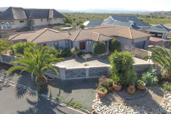 Exclusive Home with Fine Finishes in an Upmarket and Sought-After Area with Views of the Swartberg Mountain Range.

Welcome to your ...