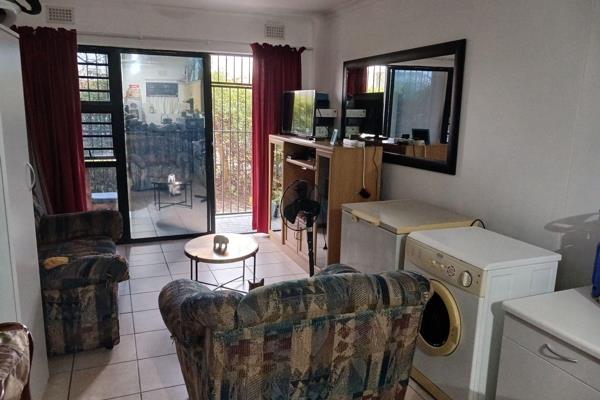 Open plan modern Kitchen and lounge area with breakfast nook and under counter oven, hob &amp; extractor.  Plumbing for washing ...