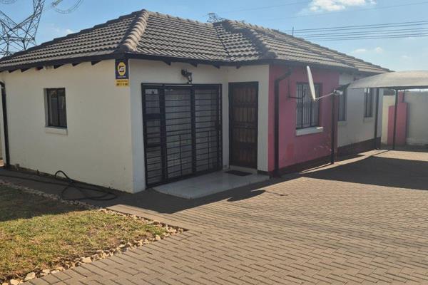 This is a 4 bedroom house with 2 bathroom and covered packing, main bedroom in suite and ...