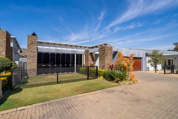 This ultra-modern THREE-bedroom, two-bathroom home features clean lines, large windows, and a minimalist design. The open-plan layout ...