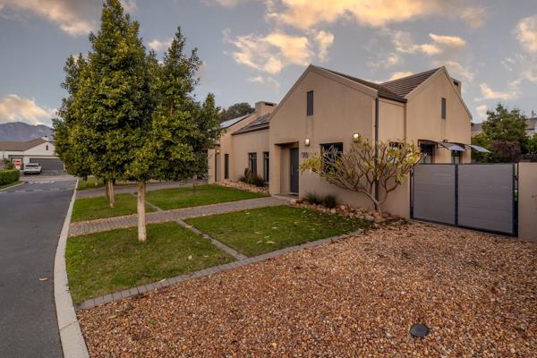 Discover modern family living in this exquisite home, nestled within the exclusive ...