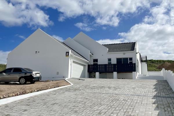 Embrace the epitome of coastal living in this magnificent newly built home.  Perched in ...