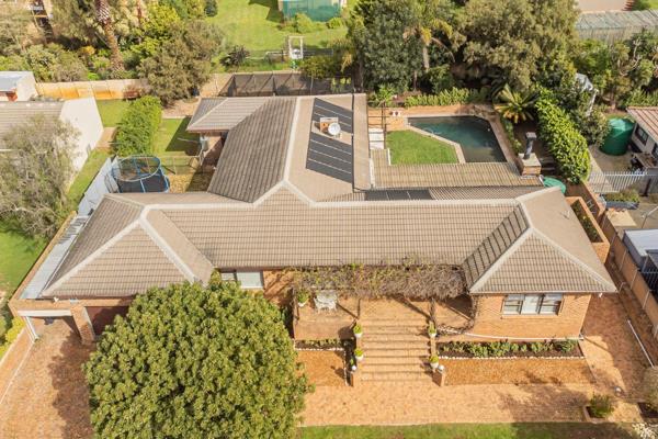 Welcome to your dream home in the sought-after Bergsig neighborhood of Durbanville ...