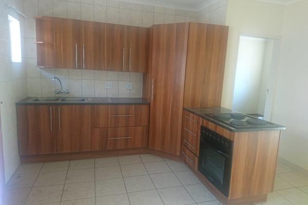 1 bedroom unit with carpet, en-suite bathroom consist of shower, toilet and basin.
open plan kitchen/dining/living room with ample cupboards, under counter oven and granite tops
TV room with patio sliding door.