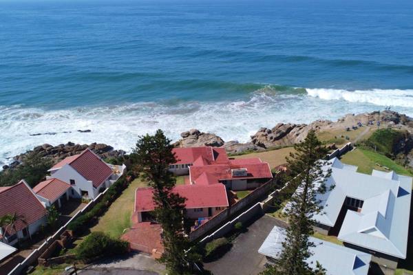 Location, location, location! This rare oceanfront property, perched on the rocks right on the beach, holds immense potential. ...