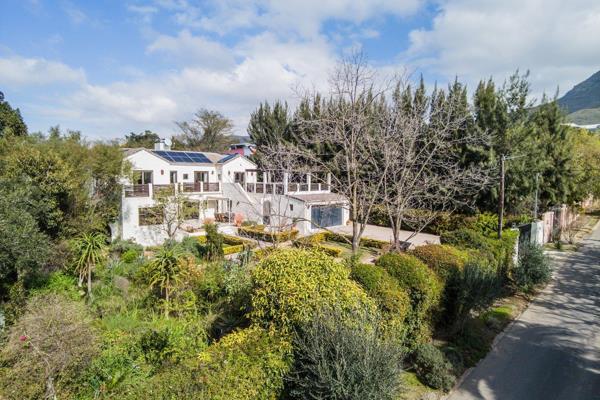 This beloved and meticulously maintained Tuscan-style home is a standout in Riebeek ...