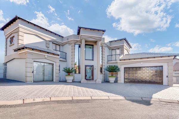 Welcome to your dream home in this prestigious Ruimsig Golf Estate! 
This luxurious double-storey property boasts elegance, modern ...