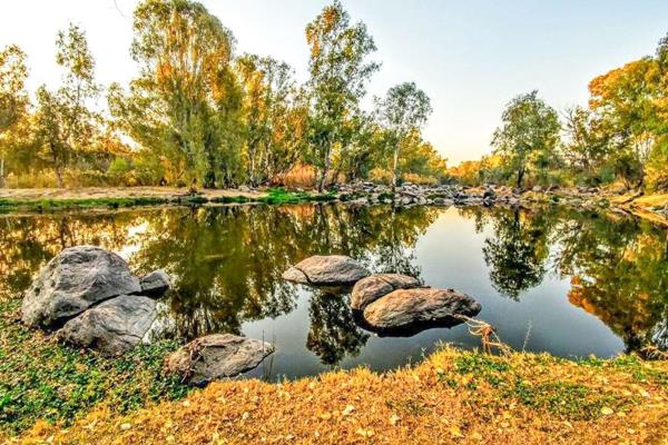 Nestled along the serene banks of the Vaal River, this tranquil lodge offers a peaceful retreat in the picturesque town of Parys. ...