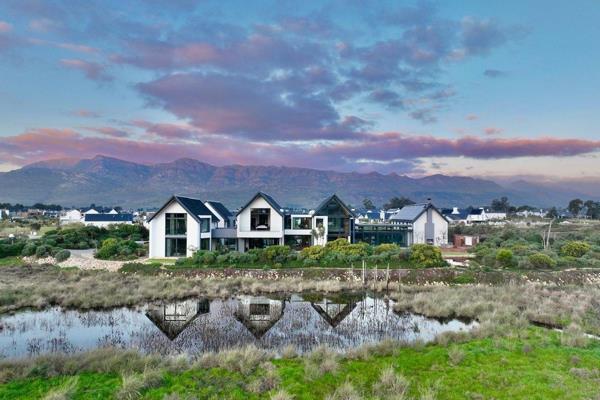 Nestled on a sprawling 2.5635-hectare estate with breathtaking views of the Simonsberg mountains, this extraordinary smallholding ...