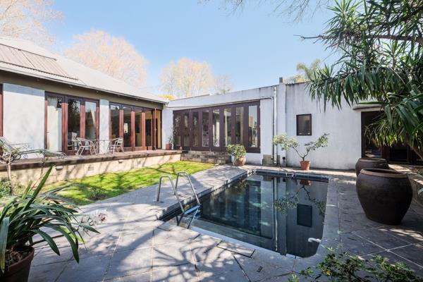 Perfectly positioned in Norwood on the Houghton border! A magnificent Balinese door welcomes you into an enchanting front courtyard ...