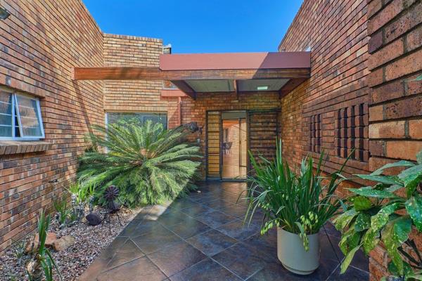 An Architectural blend of wood and brick with emphasis on space and natural light. Serious seller asking R3 499m. Feature entrance hall ...