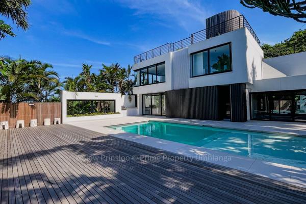 Welcome to your dream residence nestled in the heart of La Lucia, Umhlanga, where modern sophistication meets lavish comfort. This ...